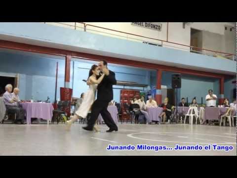  Paola Tacchetti  and  José Luis Ferraro  are  dancing  to  the  vals  "  Pasion  "