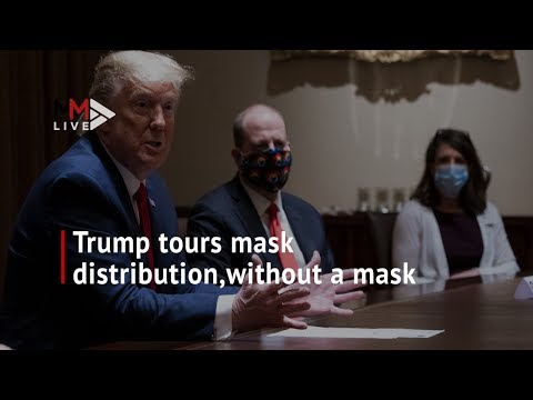 Donald Trump tours mask distribution centre but doesn't wear one