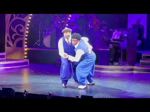 Ain’t Misbehavin’ trailer frame focusing on a vocalist at the microphone with band behind