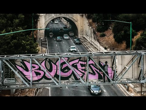 BROAD DAYLIGHT GRAFFITI | BUGE (BAMC) on HIGHWAY SIGN over SPEEDING TRAFFIC on the 110 FWY in LA