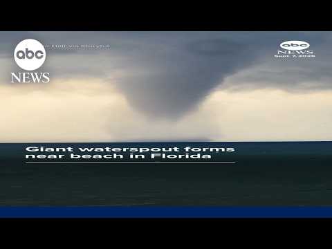 Giant waterspout forms near beach in Florida
