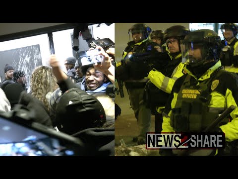 Riot police arrive as anti-ICE protesters force way into hotels housing agents in Minneapolis