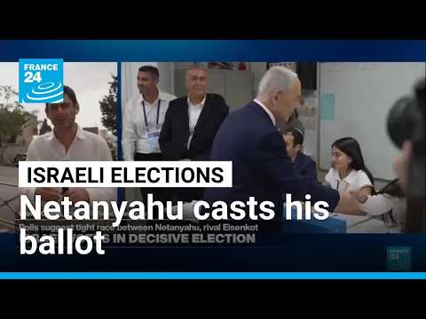 Israeli PM casts his ballot as voters voice opposition to Netanyahu outside polling stations