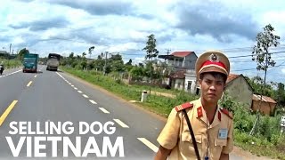 SELLING DOG AT  A VIETNAM MARKET