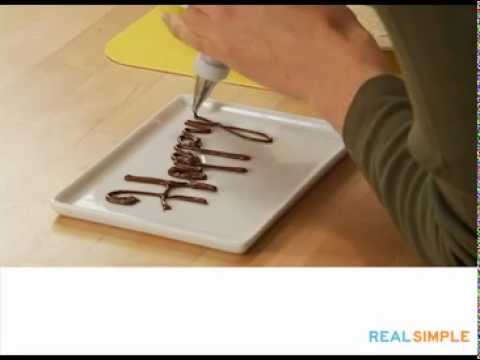 Part of a video titled Real Simple How To: Write on a Cake Video - YouTube