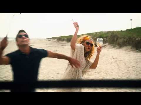 The badminton match between two men on the beach