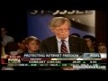 John Bolton Dodges Question; Insults Anti-War.