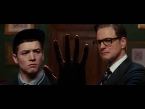 Kingsman: The Secret Service official trailer frame with Eggsy and Harry in the Kingsman tailor shop