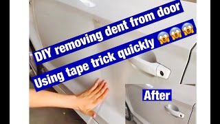 How to remove dent from car door with tape DIY trick #diydentremovel