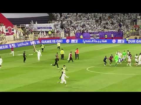 Wahda fans invade pitch and fight police after Al Ain game, Soufiane Rahimi provokes by taking flag
