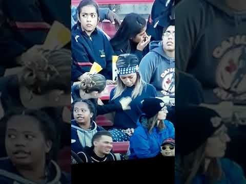 Lesbian love caught on camera in sports crowd.