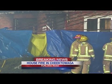 Fire crews set up tarp at scene in Cheektowaga