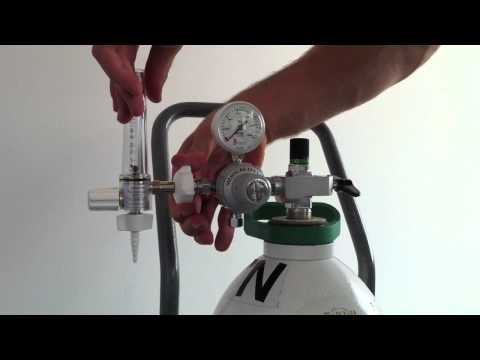 Fitting a regulator and flowmeter to a gas cylinder demonstr...