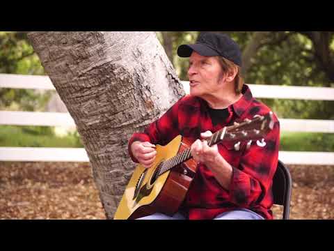 John Fogerty sings Lookin' Out my Back Door from his home.