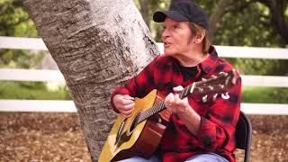 John Fogerty sings Lookin&#39; Out my Back Door from his home.