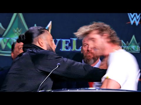 ROMAN REIGNS SENDS LOGAN PAUL FLYING ACROSS STAGE AFTER PUSH! MAKES HIM ACKNOWLEDGE HIS TRIBAL CHIEF
