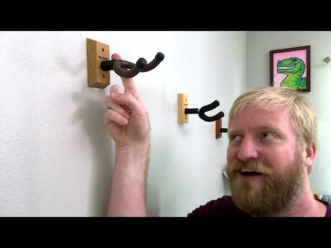 NUALLY Wall Mount Guitar Hanger, Universal Metal Hook Holder with Soft Foam Arms for Acoustic, Electric Guitars, Bass, Ukulele and String Instruments(Bronze,4 pcs) video review thumbnail