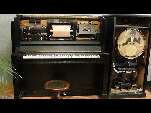 Pianola with an electric engine and a percussion attachment