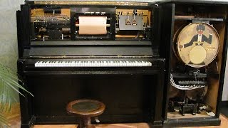 Pianola with an electric engine and a percussion attachment
