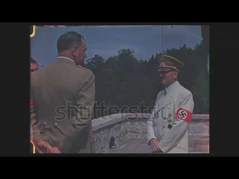CIRCA 1940s - Color, Hitler talks to Himmler and others on his terrace at his Berchtesgaden retreat,