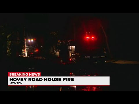 Fire officials responding to a multi-alarm structure fire in Monson