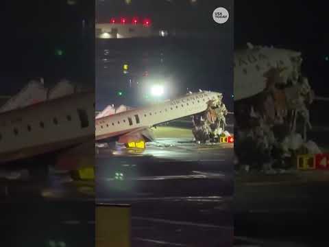 Plane collides with fire truck at New York's LaGuardia airport killing 2