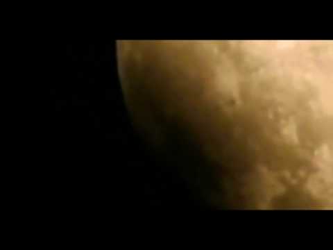 Boomerang UFO moving across the moon