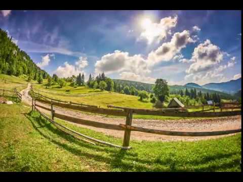 Rolling summer clouds at Stone House Village and a hen named Veta.