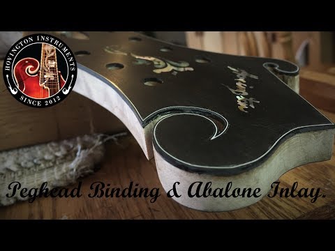 F-Style Peghead Binding & Abalone Inlay.