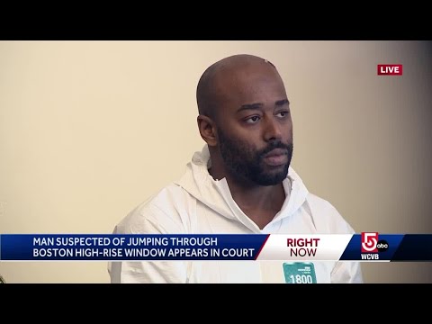 Suspect found dangling from high-rise window held