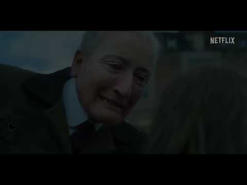 Matilda The Musical 2022 official trailer frame of Matilda standing defiant in the school corridor as the chorus swells