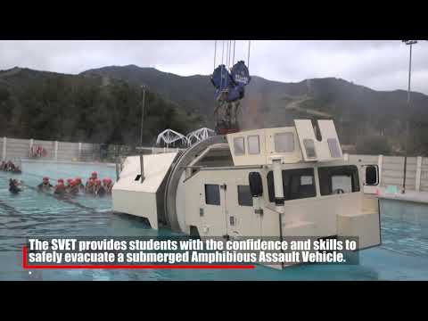 Assault Amphibian School students take a ride in the Submerged Vehicle Egress Trainer