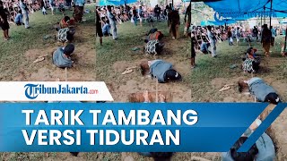 Sebuah Video Viral Memperlihatkan Cara Main Tarik Tambang sambil Tiduran