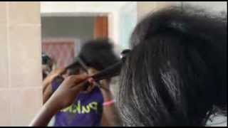 African Girl straightens her natural hair