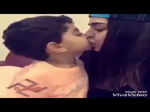 Naughty baby boy  kissed to his Cousin,mother and son,hugs and kisses.Stock Footage Extremely fun,