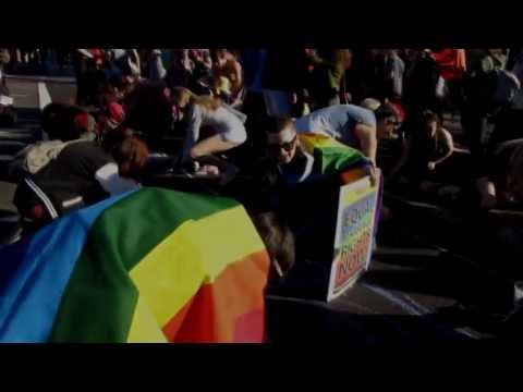 Equal marriage rights march chalks a rainbow crossing