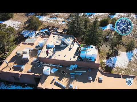 Roof installation with Blue Bear Roofing logo