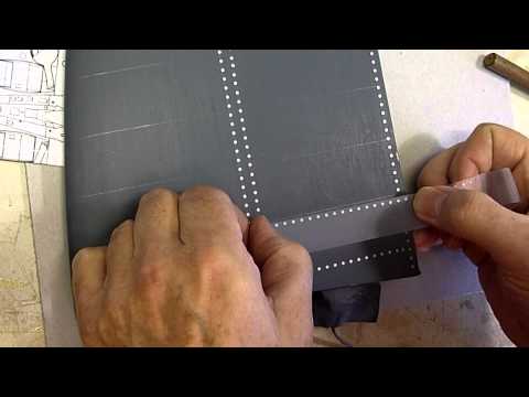 Applying rivets to a 1/4-scale Spitfire