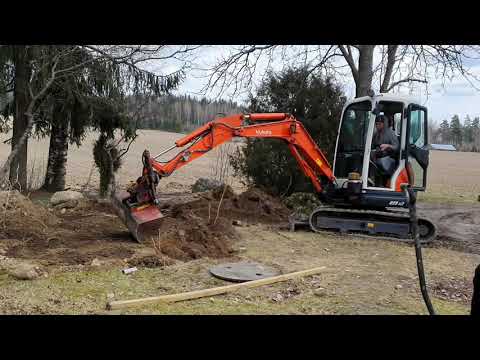 Filling trench with Kubota U25 excavator