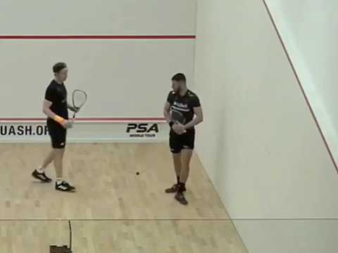 SQUASH. George Parker breaks a squash racquet on his knee