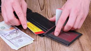 Класичний чоловічий гаманець з хлястиком із натуральної шкіри KARYA 21079 чорний