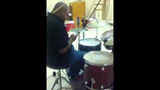 Drummer for the Michael Foster Project playing with one hand