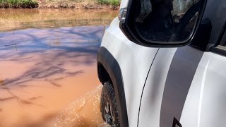 Tacoma crosses flooded creek
