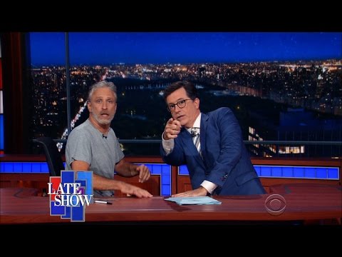 , title : 'Jon Stewart Takes Over Colbert’s Late Show Desk'