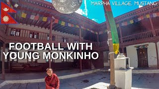 Playing football with a young monk in Marpha Monastery, Mustang - Nepal Motovlog EP 14