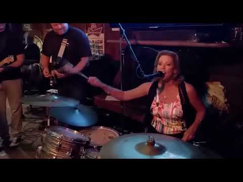 Gigi Worth plays drums and sings lead on Chain of Fools