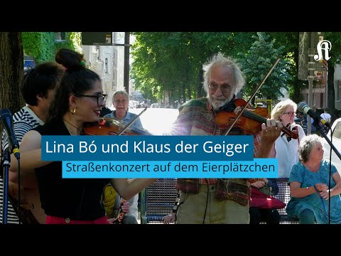 Lina Bó und Klaus der Geiger spielen Straßenkonzert in Köln
