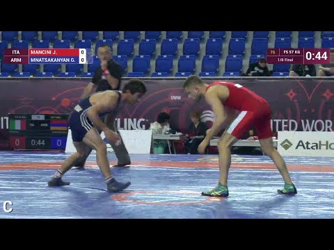 1/8 FS - 57 kg: G. MNATSAKANYAN (ARM) df. J. MANCINI (ITA), 6-4