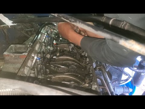 inside a cummins m11 engine installing exhaust,intake and injector push rods and push tubes.