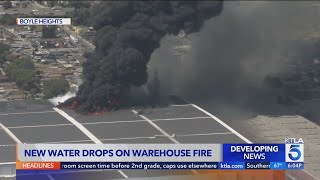 Crews continue dropping water on Boyle Heights warehouse fire